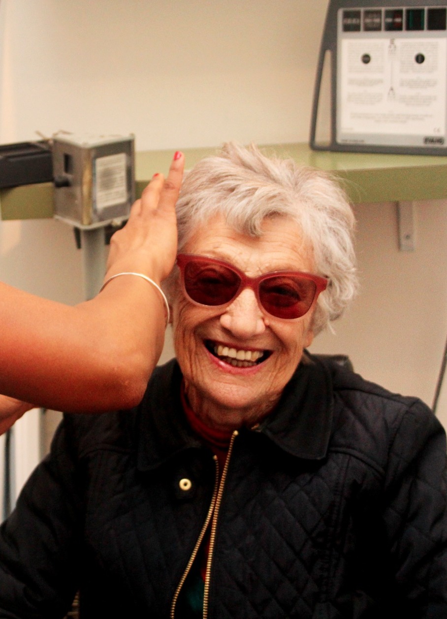 Older woman being fitted with tinted glasses